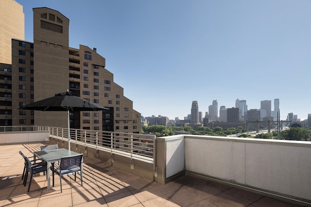 view of patio featuring a balcony