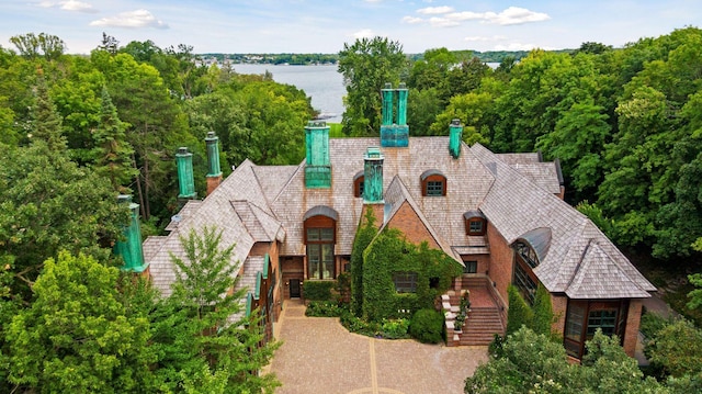 view of front of house with a water view