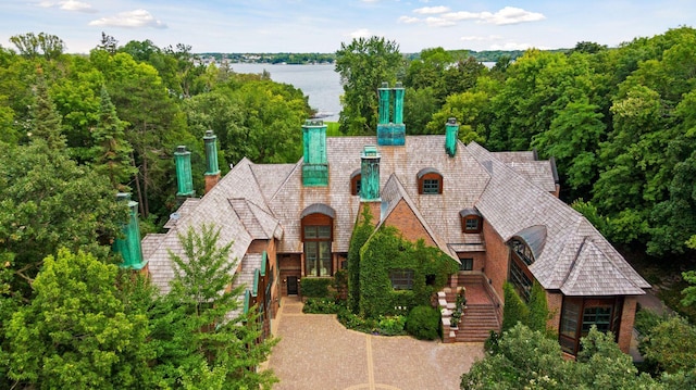 17950 Breezy Point Rd, Woodland, MN 55391 - view of front of property with a chimney, a water view, and stairway