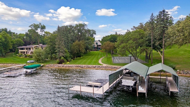 17950 Breezy Point Rd, Woodland, MN 55391 - dock area with a water view, boat lift, a lawn, and view of wooded area