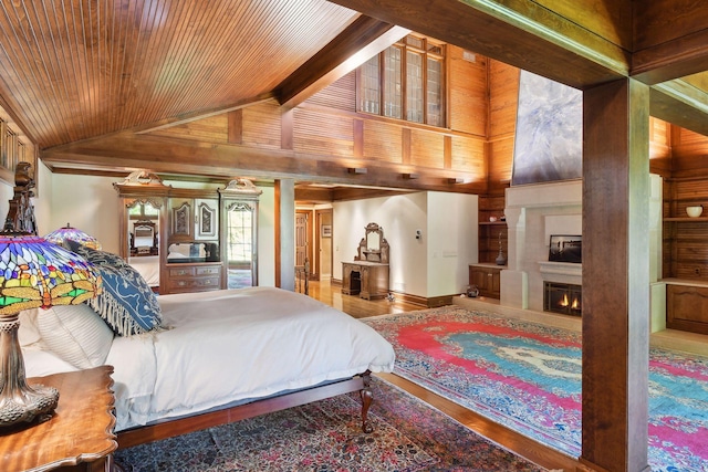 17950 Breezy Point Rd, Woodland, MN 55391 - bedroom featuring wood finished floors and a fireplace