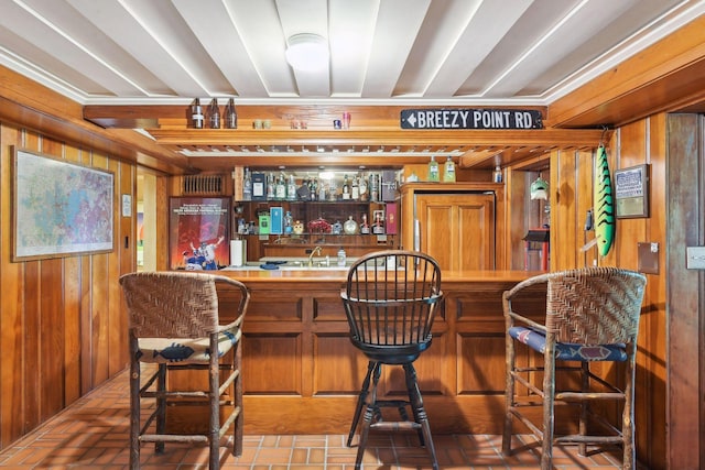 17950 Breezy Point Rd, Woodland, MN 55391 - indoor wet bar featuring wood walls and brick floors