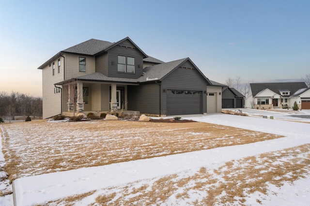 view of front of home featuring a garage and covered porch