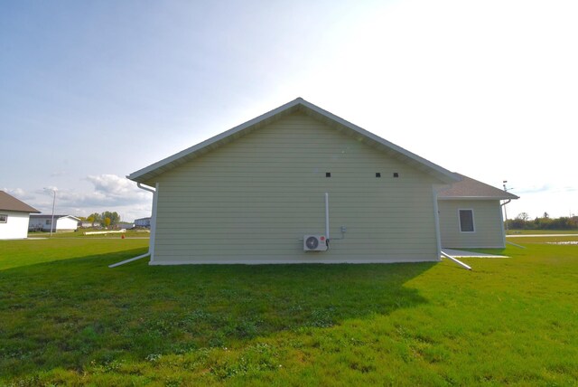 view of home's exterior with a yard