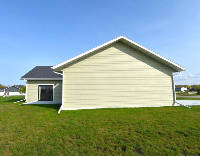 view of home's exterior featuring a lawn