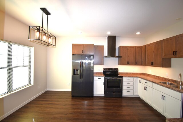 kitchen with wall chimney range hood, dark hardwood / wood-style flooring, stainless steel fridge with ice dispenser, black electric range oven, and sink