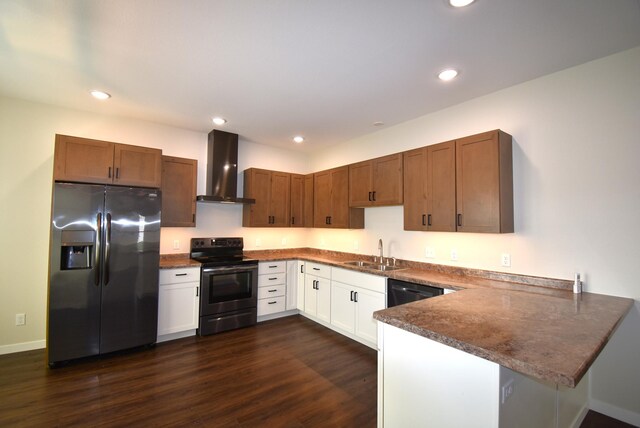 kitchen featuring wall chimney range hood, white cabinets, dark hardwood / wood-style flooring, black appliances, and sink