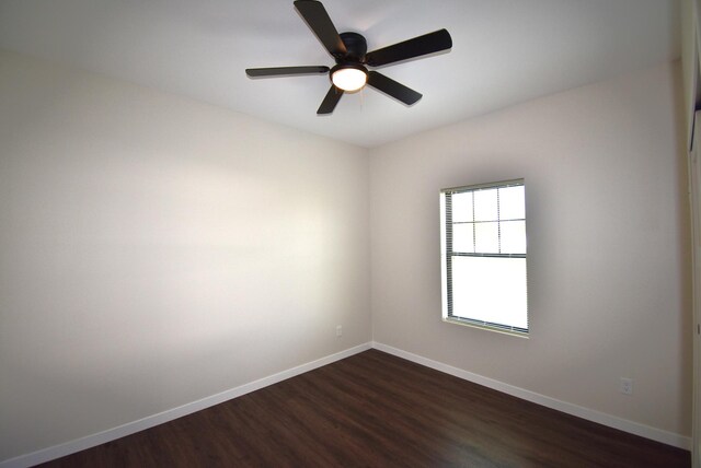 spare room with ceiling fan and hardwood / wood-style floors