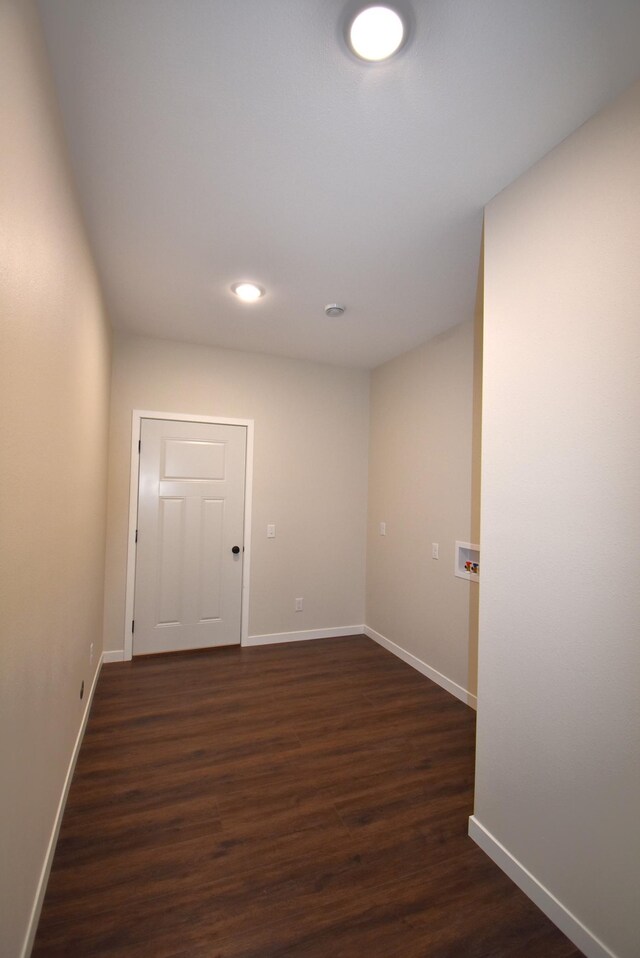 unfurnished room featuring dark hardwood / wood-style flooring