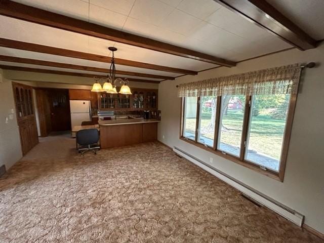 interior space with a baseboard heating unit, carpet, beamed ceiling, white fridge, and pendant lighting