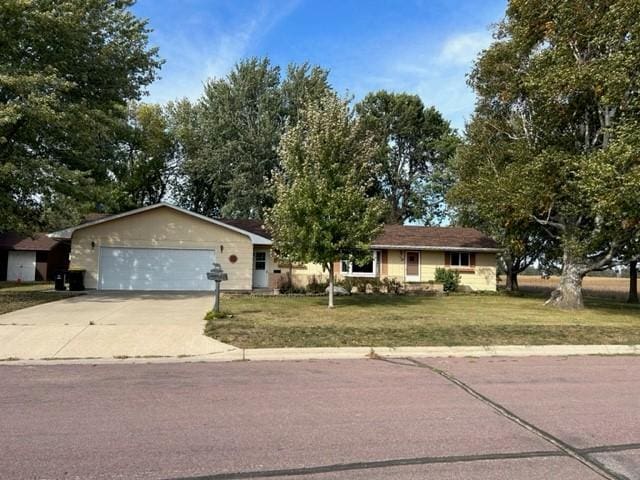 single story home with a front lawn and a garage