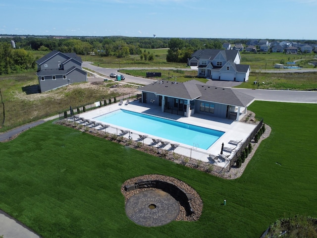 view of pool featuring a fenced in pool, fence private yard, a patio area, and a lawn