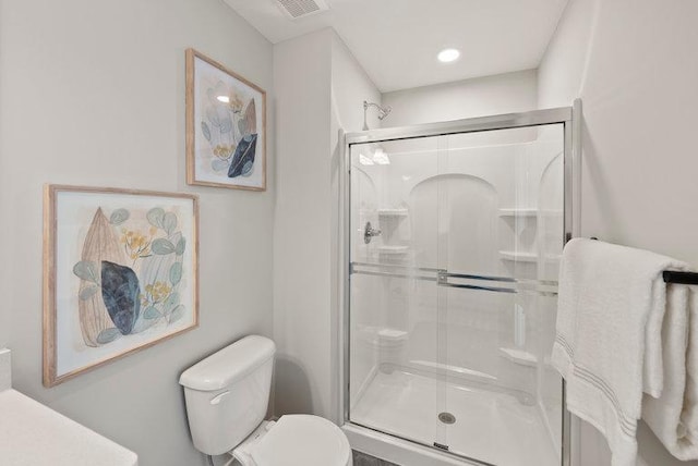 full bath featuring visible vents, a shower stall, and toilet