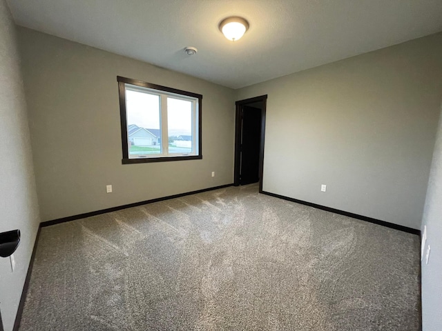 unfurnished room with carpet