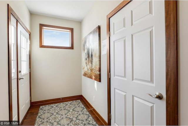 doorway to outside with dark wood-type flooring