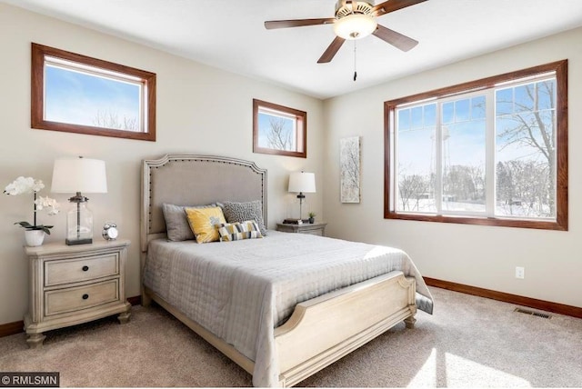 bedroom featuring ceiling fan and light colored carpet