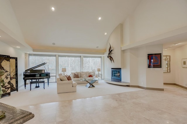1 Capaul Woods Ct, North Oaks, MN 55127 - tiled living area with a glass covered fireplace, recessed lighting, and a high ceiling