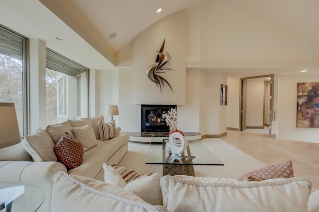 living room featuring a multi sided fireplace and vaulted ceiling