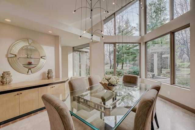 1 Capaul Woods Ct, North Oaks, MN 55127 - dining area featuring light tile patterned floors, recessed lighting, a chandelier, and a towering ceiling