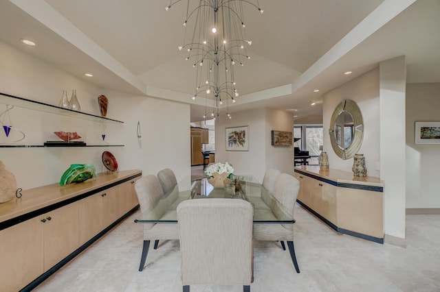 dining space featuring light tile patterned flooring and an inviting chandelier