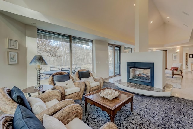 living room featuring a multi sided fireplace and high vaulted ceiling