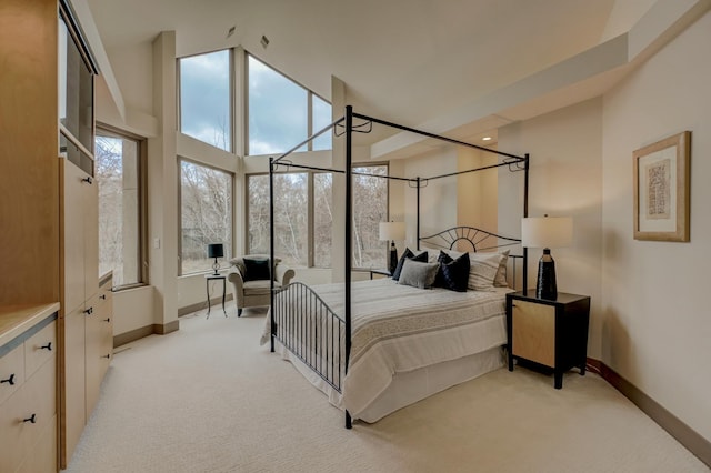 bedroom with light colored carpet