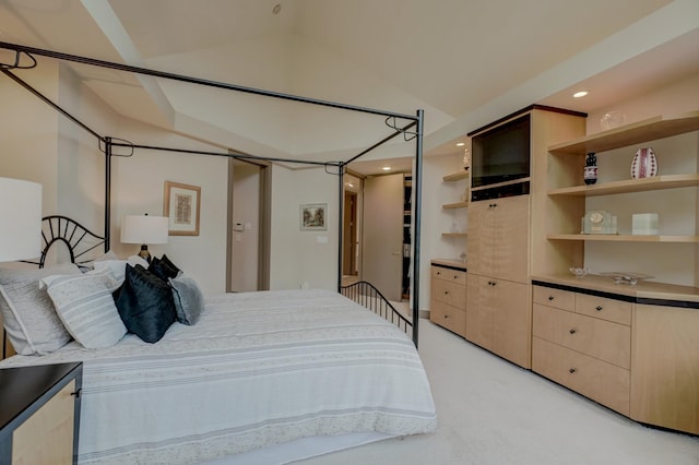 carpeted bedroom with vaulted ceiling