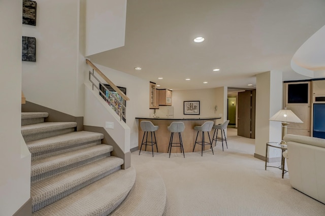 1 Capaul Woods Ct, North Oaks, MN 55127 - kitchen with light carpet, a breakfast bar, recessed lighting, a peninsula, and open floor plan