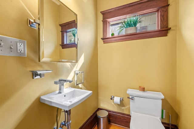 bathroom with toilet and sink