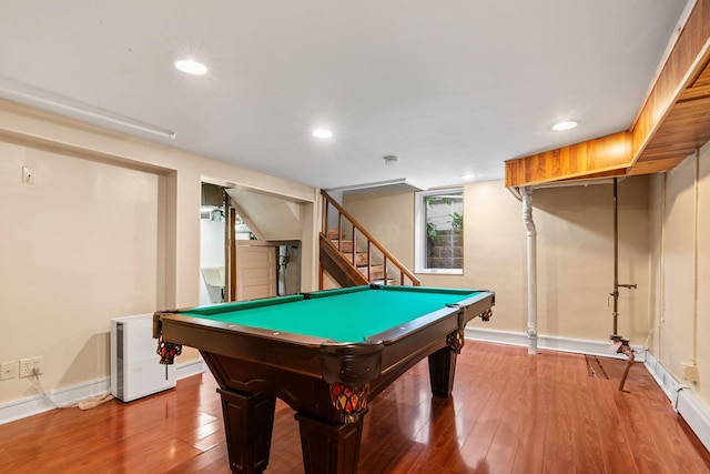 recreation room with pool table and hardwood / wood-style flooring