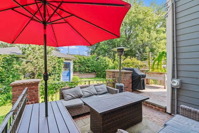 view of patio with grilling area and an outdoor living space