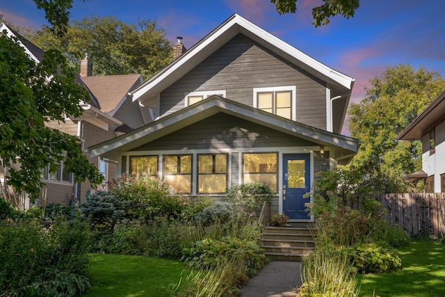 view of front of home featuring a lawn