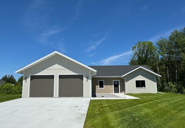 view of front of home with a garage and a front yard