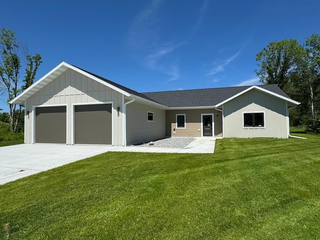 view of front of property with a garage and a front yard