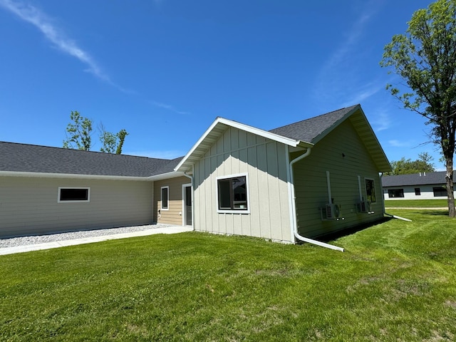 view of side of home featuring a yard