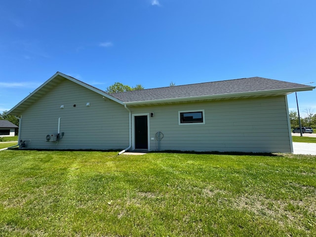 back of house with a yard