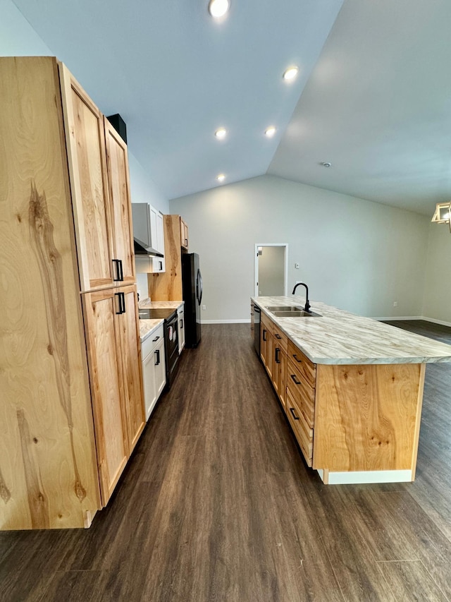 kitchen featuring black appliances, light brown cabinetry, sink, and lofted ceiling