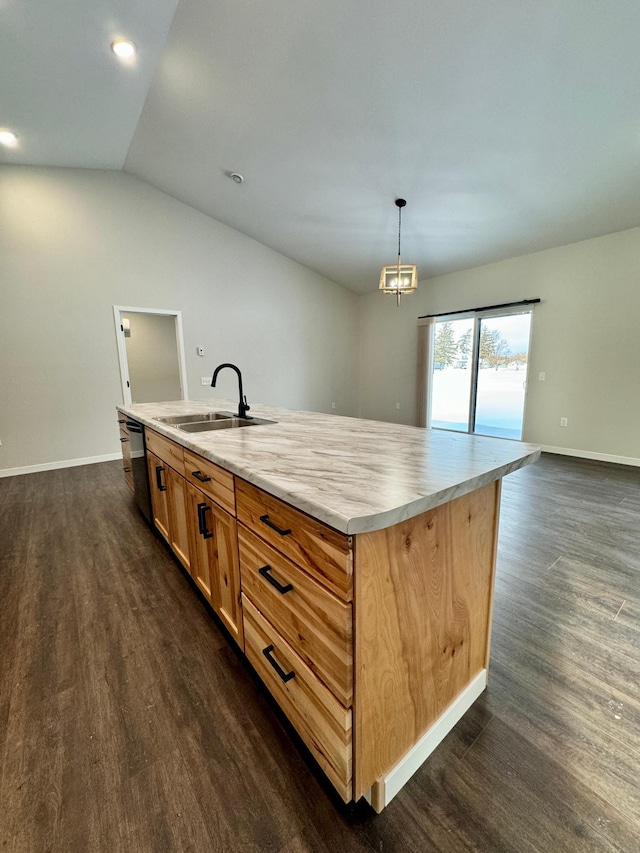 kitchen with an island with sink, sink, hanging light fixtures, dark hardwood / wood-style floors, and vaulted ceiling