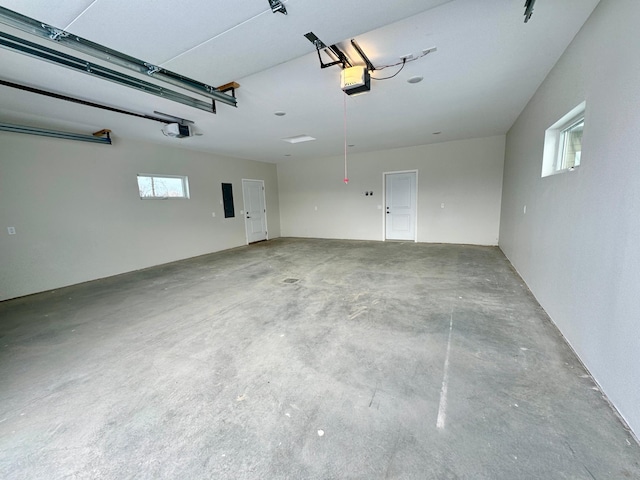 garage featuring a garage door opener and electric panel