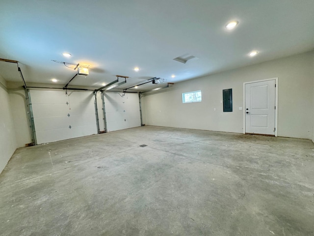 garage featuring a garage door opener and electric panel