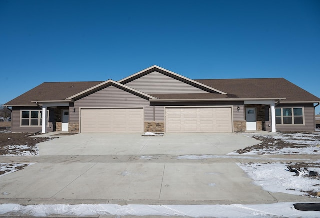 ranch-style house featuring a garage