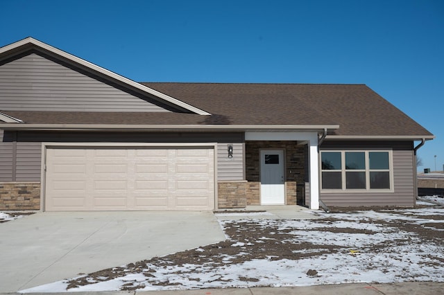 ranch-style home featuring a garage