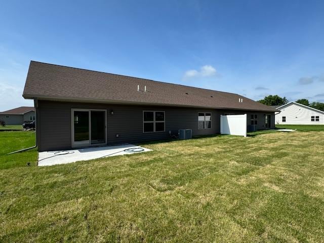 2214 Red Bird Ln, Fairmont, MN 56031 - rear view of property featuring a patio area and a lawn