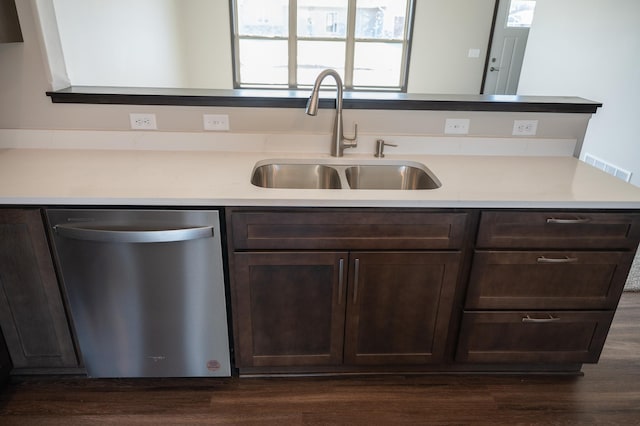 2214 Red Bird Ln, Fairmont, MN 56031 - kitchen with stainless steel dishwasher, dark brown cabinetry, dark wood-style floors, and light countertops