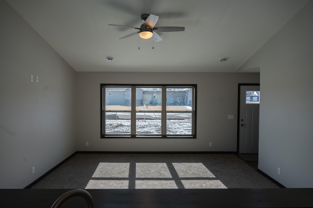 2214 Red Bird Ln, Fairmont, MN 56031 - empty room with dark colored carpet and ceiling fan