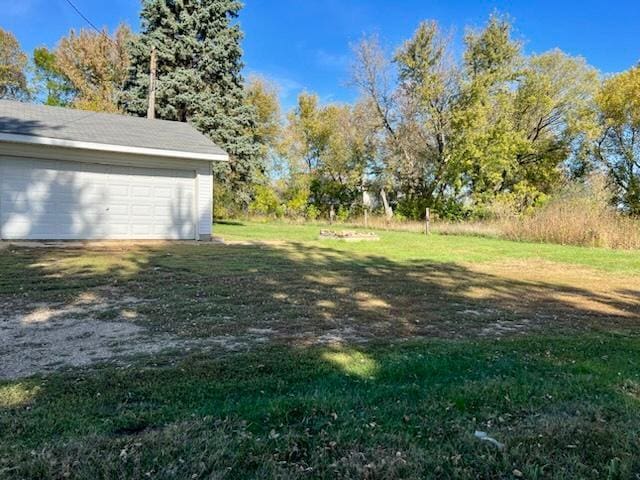 view of yard with a garage