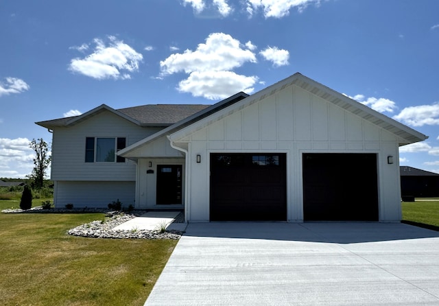 modern inspired farmhouse with a front lawn