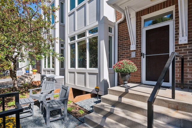 view of exterior entry with a porch