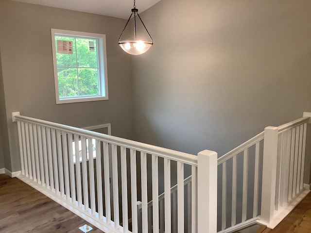 stairway featuring hardwood / wood-style flooring