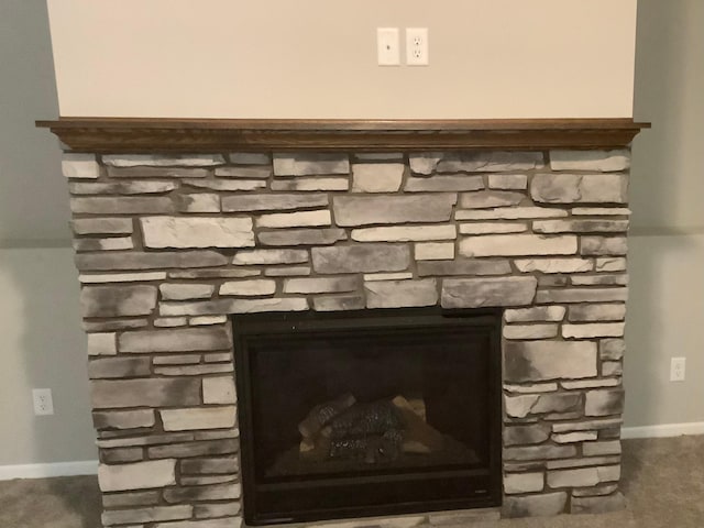 details with a stone fireplace